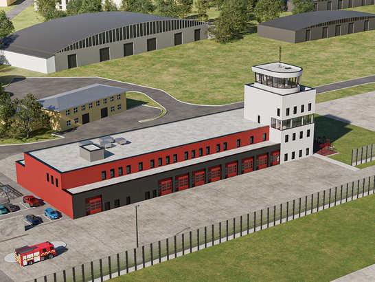 Budynki strażackie z czerwoną i czarną częścią garażową dla pojazdów, w tym widoczny czerwony wóz strażacki. Obok znajduje się wieża obserwacyjna na białym budynku. Na terenie znajdują się również inne pojazdy i drogi dojazdowe.